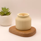 Bougie parfumée dans un pot en jesmonite jaune